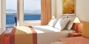 Croisière CCL Carnival Sunrise vers l'arrière (poupe) avec balcon étendu cabine